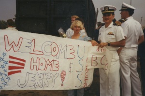Leah and I holding the sign she, Jenn, and Mom made for our arrival home. Dad was onboard too for the last leg of the trip.