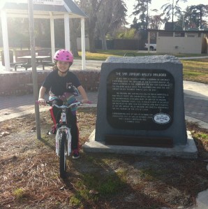 Gigi next to the Railway Bike Trail Marker near Old Town Clovis