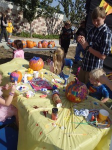 Kids painting pumpkins at the Clovis Hills Pumpkin Party